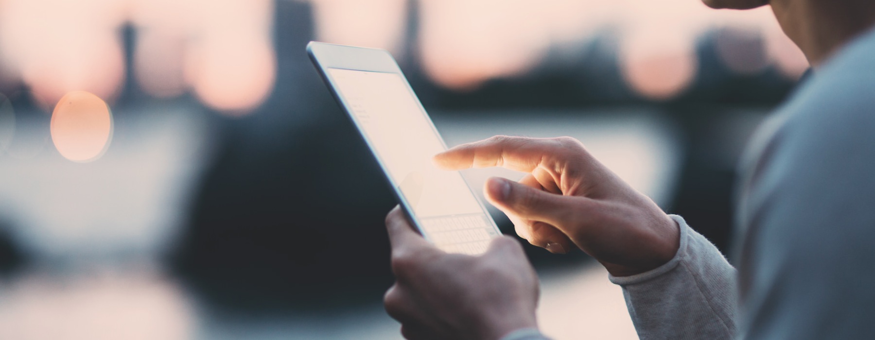 a man holding a tablet